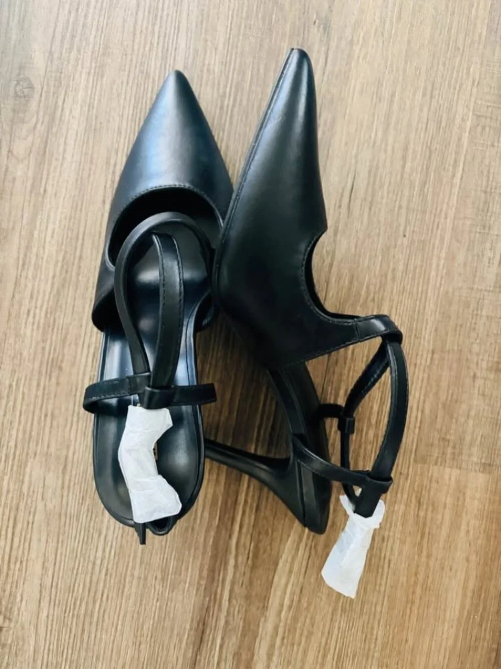 black slingback pointed-toe flats from